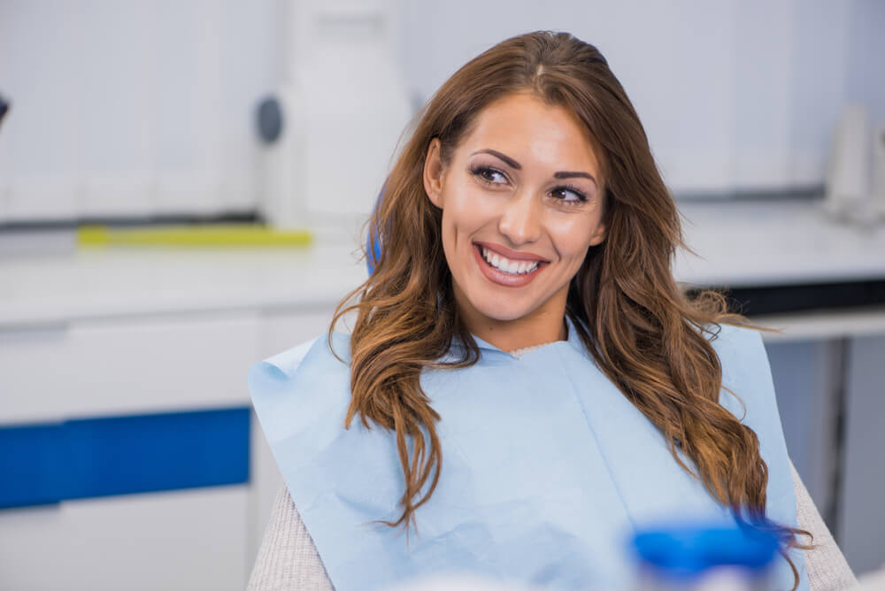 Smiling Dentist And Patient In Dental Clinic stock image