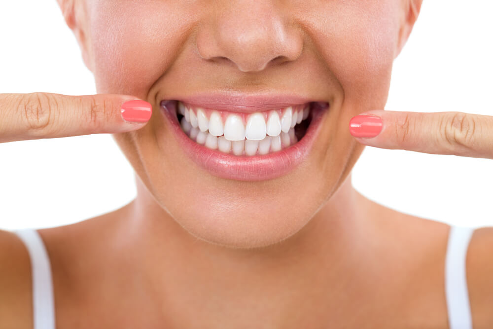 Woman Showing Her Perfect Straight White Teeth stock picture