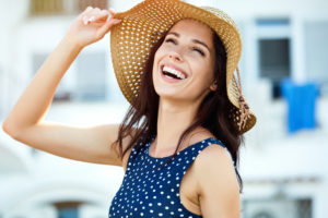 Portrait Of A Beautiful Woman In A Straw Hat Laughing Happy young couple stock image